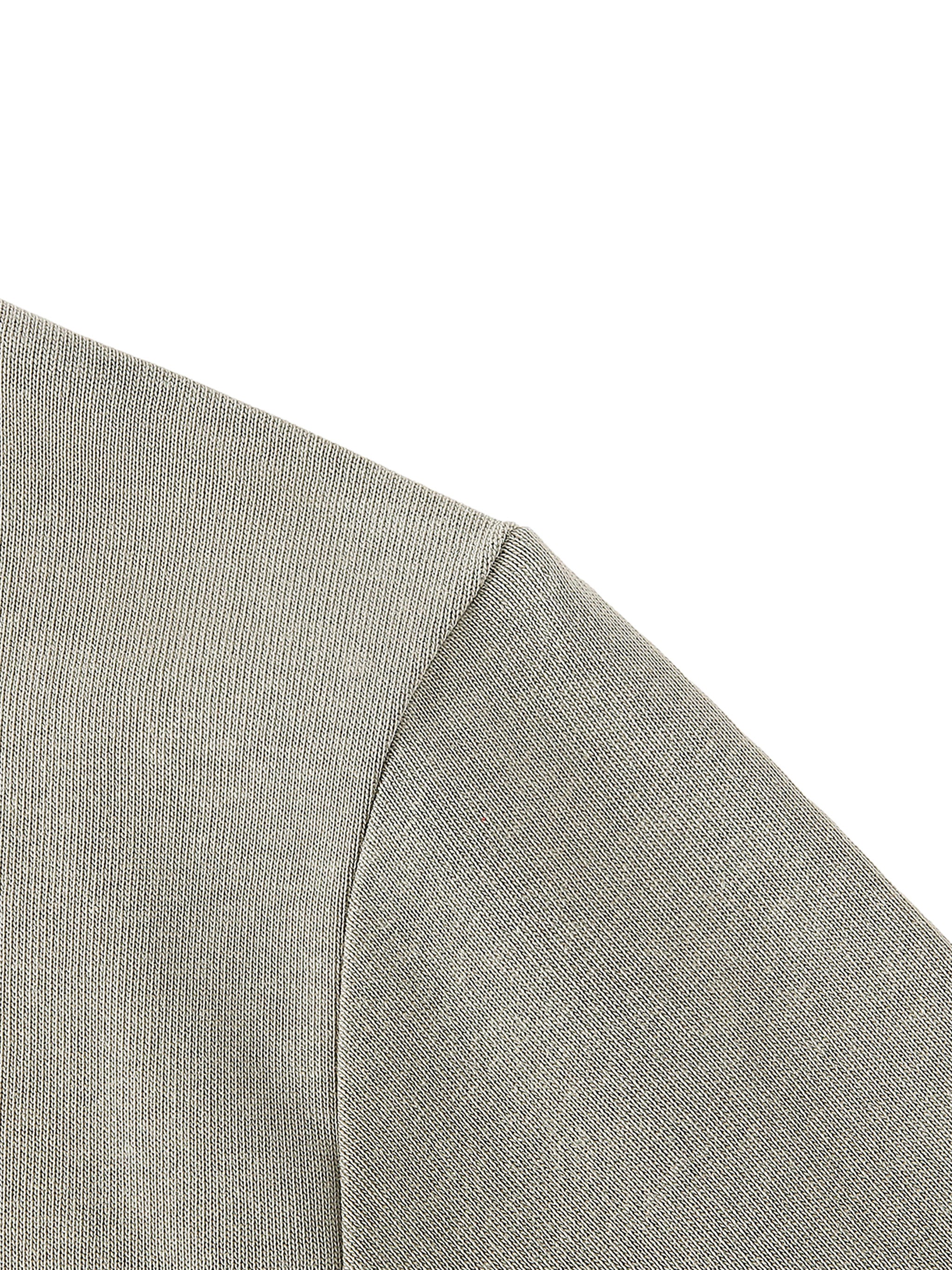 Close-up of a textured gray fabric corner on a white background
